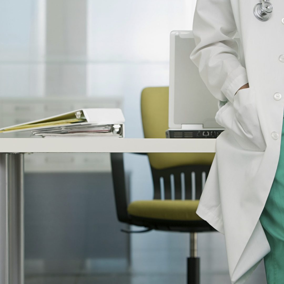 Doctor in their office